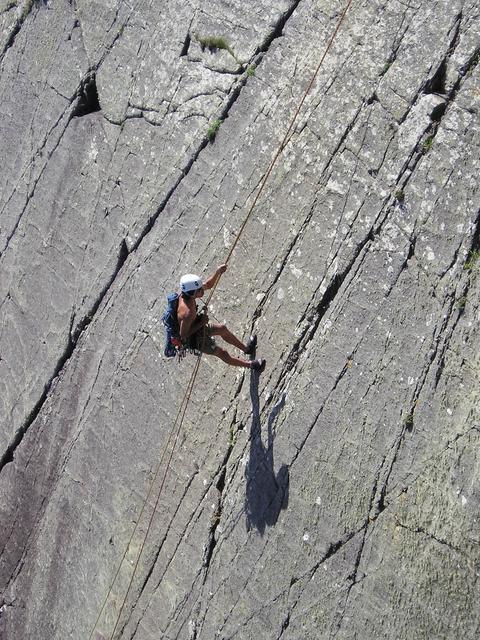 Ian checks a crack he will subsequently not climb