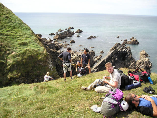 Lazing <i>in focus</i> before another abseil.